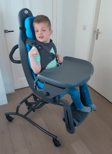 Marco in his MPS Hi Low seating system, which allow him to both play close to the ground with his friends and rise up to a dinner table and eat.