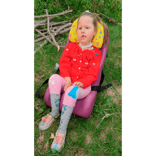 Zlata is sitting in her sitter seat out in the garden, the sitter seat is great to bring along for outdoor activities as it is tear and peel resistant and water/liquid resistant as well